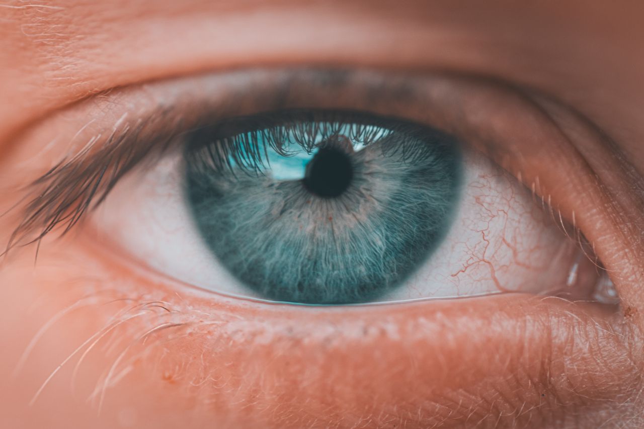 The Art of Drawing Readers In: Your attractive post title goes here Detailed close-up of a blue human eye, showcasing intricate iris patterns and natural eyelashes.